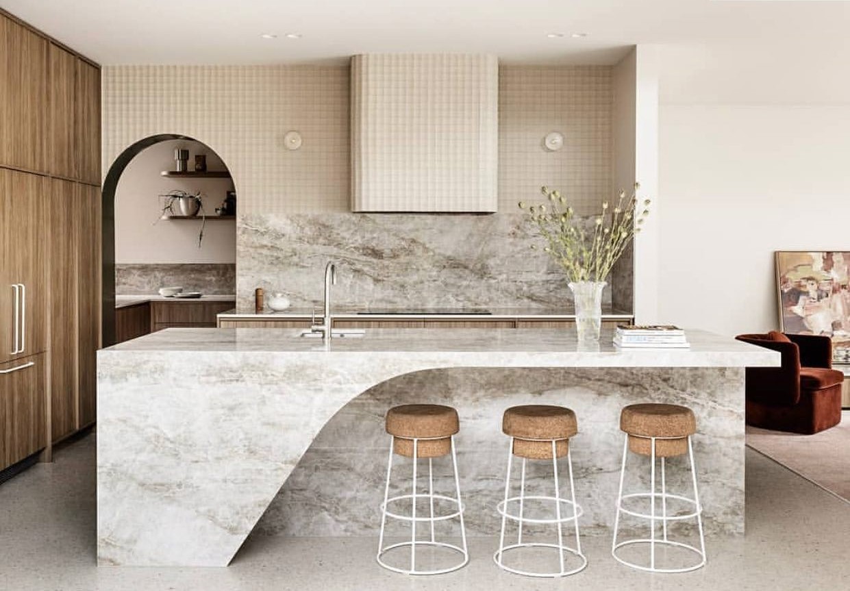 An island kitchen with a polished concrete counter.